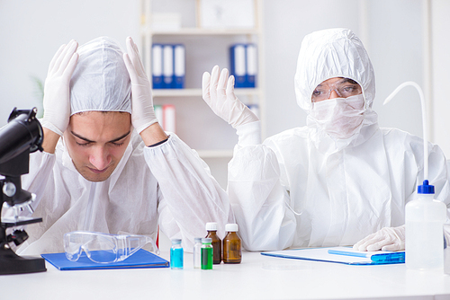 Two scientists working in the chemical lab