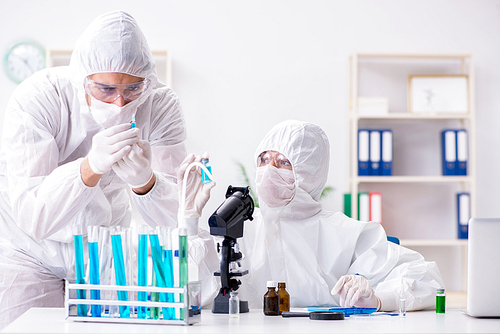 Two chemists working in the lab