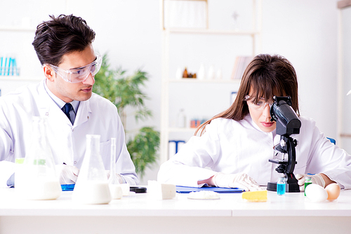 Two lab doctor testing food products