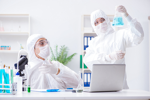 Two scientists working in the chemical lab