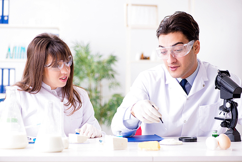 Two lab doctor testing food products