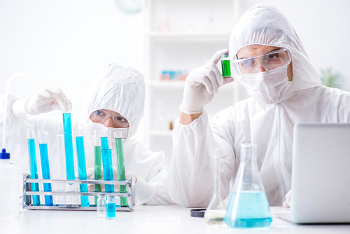 Two scientists working in the chemical lab