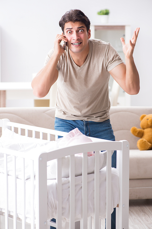 Young father dad frustrated at crying baby