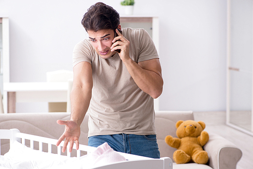 Young father dad frustrated at crying baby