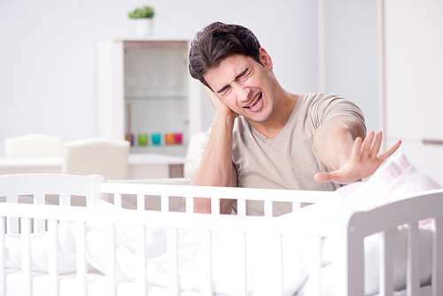 Young father dad frustrated at crying baby