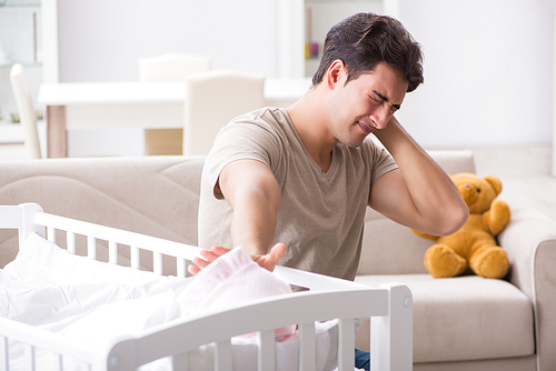 Young father dad frustrated at crying baby