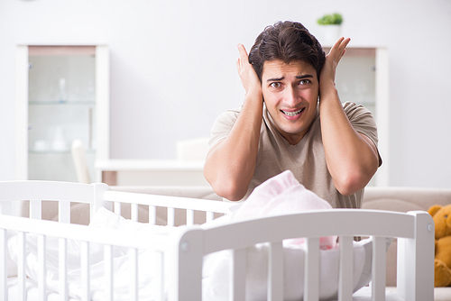Young father dad frustrated at crying baby