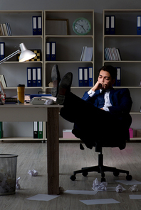 Businessman tired and sleeping in the office after overtime hours