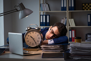 Businessman falling asleep during long hours in office