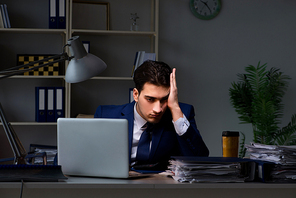 Employee working late to finish important deliverable task