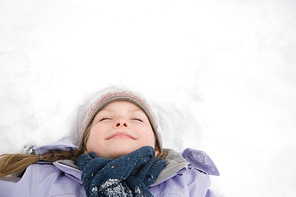 Girl lying on snow