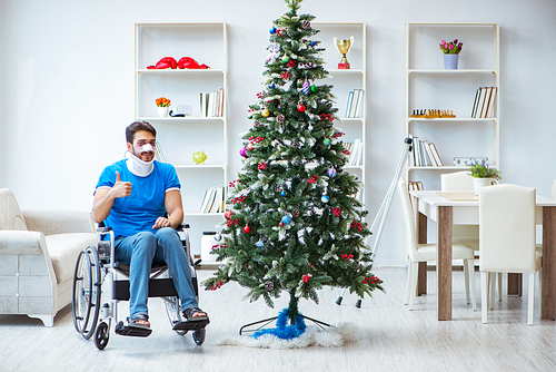 Injured disabled man celebrating christmas at home