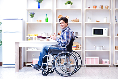 Disabled young man husband working in kitchen