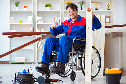 Disabled carpenter working in workshop