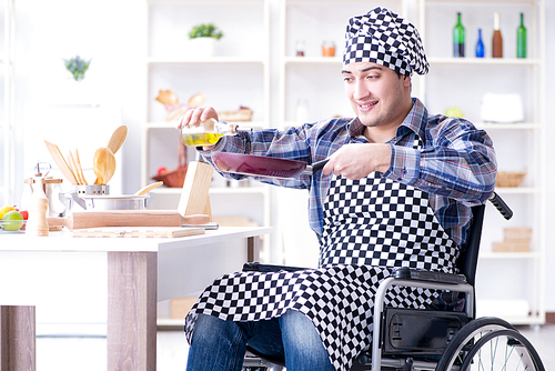 Disabled young husband frying at kitchen