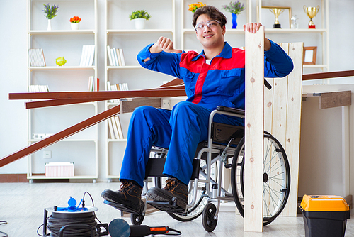 Disabled carpenter working in workshop