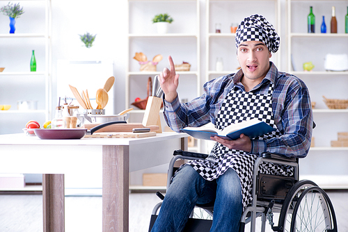 Young man cook with book of food recipes