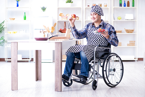 Young disabled husband preparing food salad