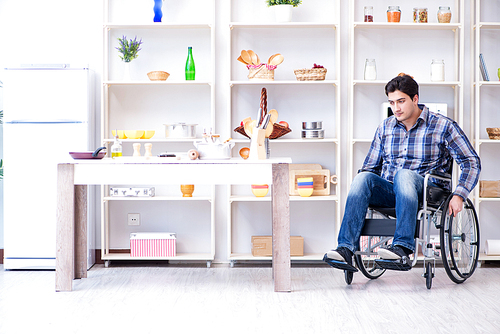 Disabled young man husband working in kitchen