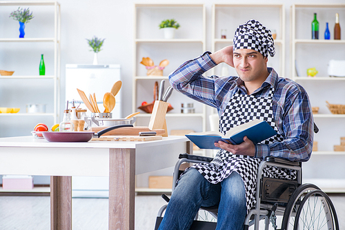 Young man cook with book of food recipes