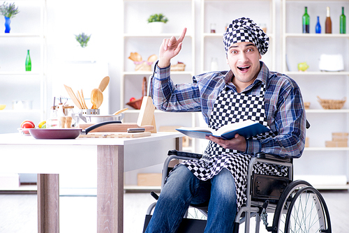 Young man cook with book of food recipes