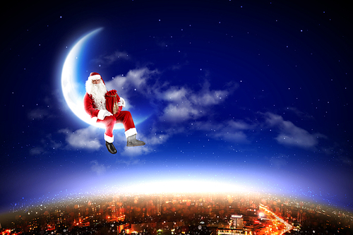 Santa Claus on the moon above a city at night