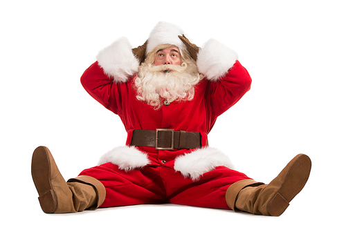 Hilarious and funny Santa Claus confused while sitting on a white background full length