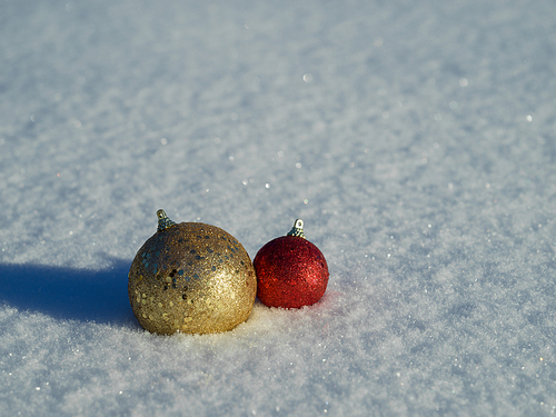 christmas balls tree decoration in fresh snow abstract background