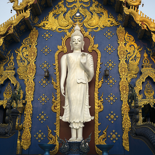 Statue of Buddha at temple, Rong Suea Ten Temple, Chiang Rai, Thailand