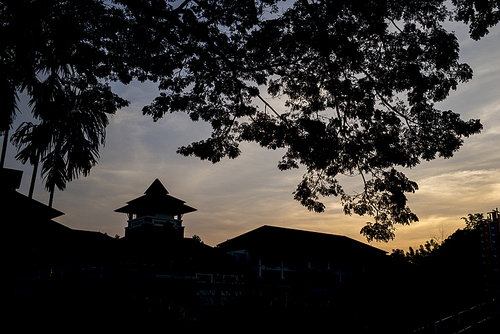 Silhouette of buildings and trees at sunset, Chiang Rai, Thailand