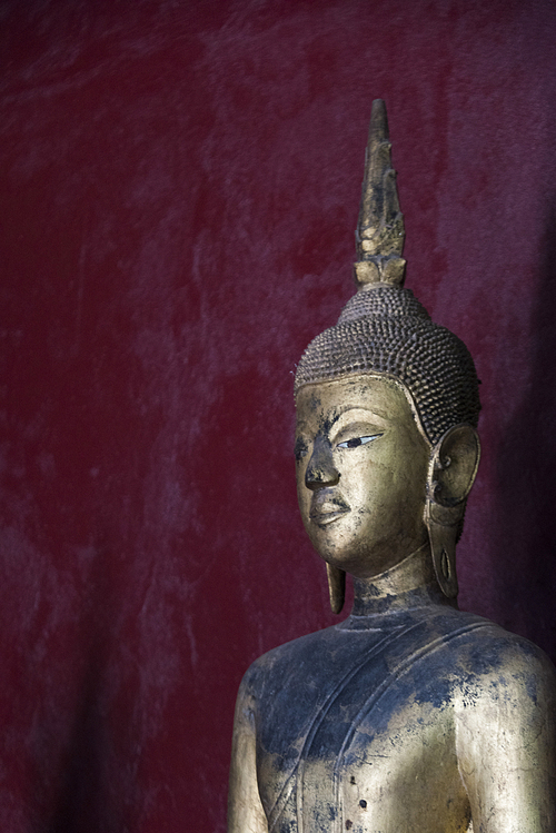 Statue in temple, Wat Xieng Thong temple, Luang Prabang, Laos
