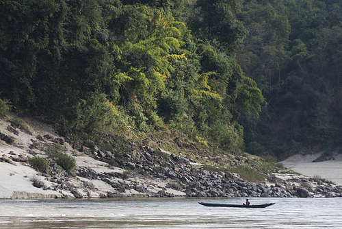 Person in a boat in River Mekong, Sainyabuli Province, Laos