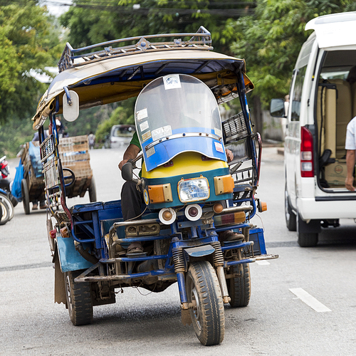 Motorized Tuk Tuk and Vehicles on road, Luang Prabang, Laos