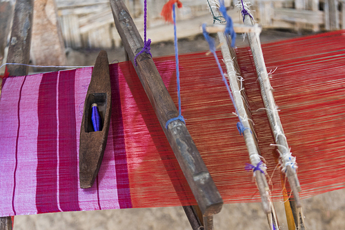 Close-up of fabric weaving on loom, Laos