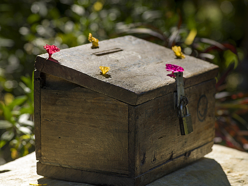Close-up of donation box, Luang Prabang, Laos