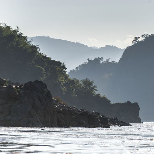 Scenic view of river with mountain range in background, River Mekong, Oudomxay Province, Laos