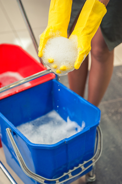 Cleaning concept. Closeup photo of woman cleaning shopping center