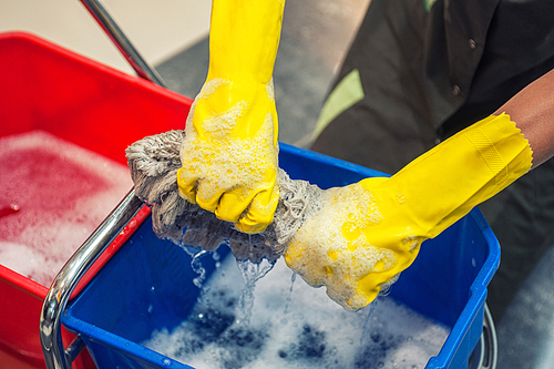 Cleaning concept. Closeup photo of woman cleaning shopping center