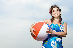 Woman holding a beachball