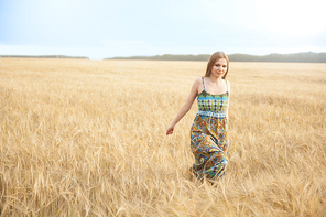 Happy woman walks freely in a wide meadow