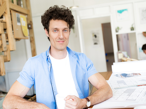 Man working with drafts in office