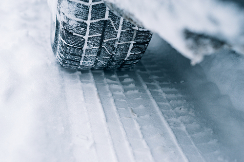 All-season tyre track on snow, winter tire concept