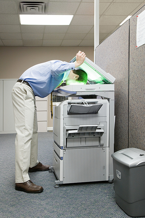 Man photocopying his head