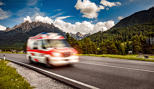 Ambulance van rushes down the highway