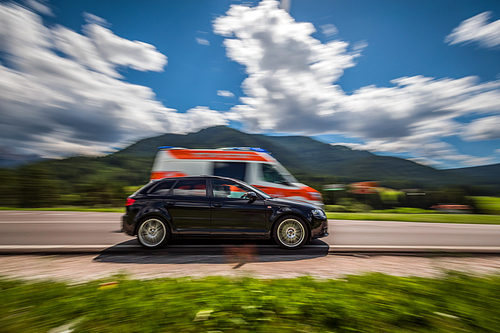 Car at high speed gives way to ambulance road. Warning - authentic shooting there is a motion blur.