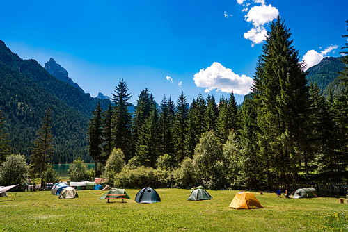 Camping on the shores of lake. Lake Dobbiaco in the Dolomites, Beautiful Nature Italy natural landscape Alps.
