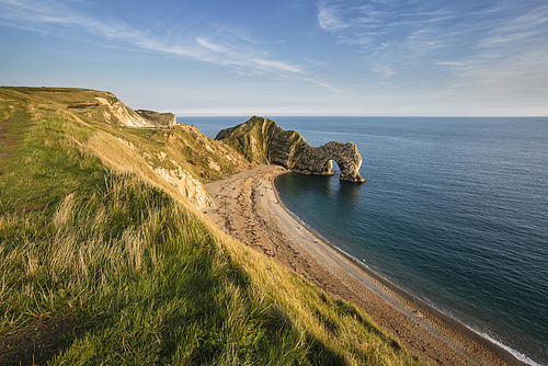 Landscape view of Durdle Door on the Jurassic Coast at sunset