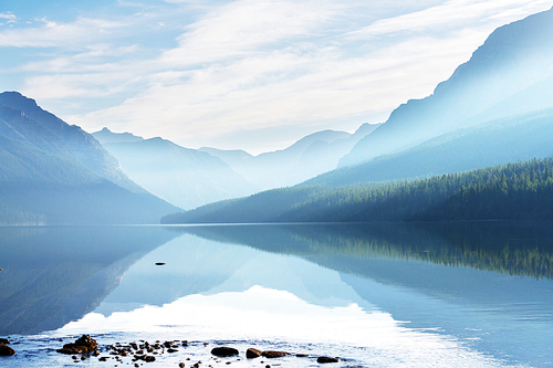 Beautiful Bowman lake with reflection of the spectacular mountains in Glacier National Park, Montana, USA. Instagram filter.