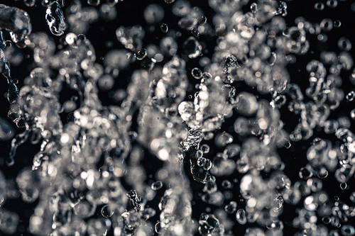 Half defocused half in focus water drops frozen in an air