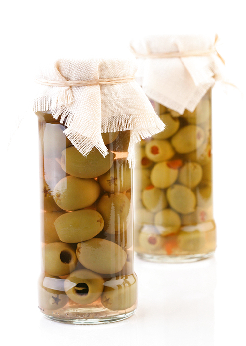 Studio shot of pickled olives in jar